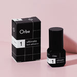 Orbe Ultimate 1 eyelash adhesive box and bottle. A PureForm® glue for pro eyelash professionals